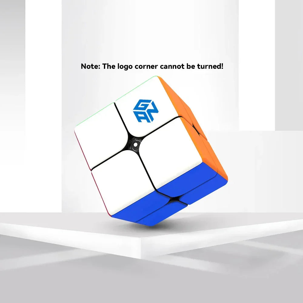 Gan 249 2x2 speed cube with blue, orange, and white stickers on a white platform
