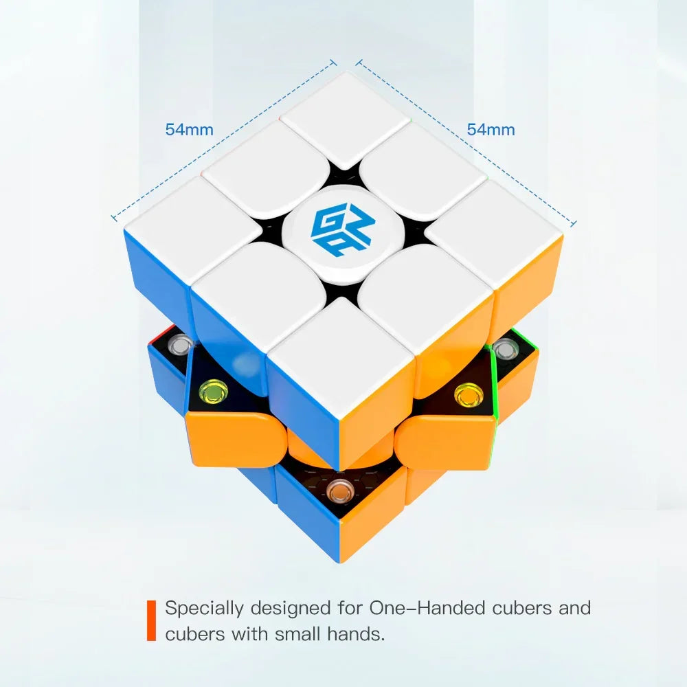 Compact 54mm speedcube puzzle designed for one-handed use and small hands, with visible internal mechanism