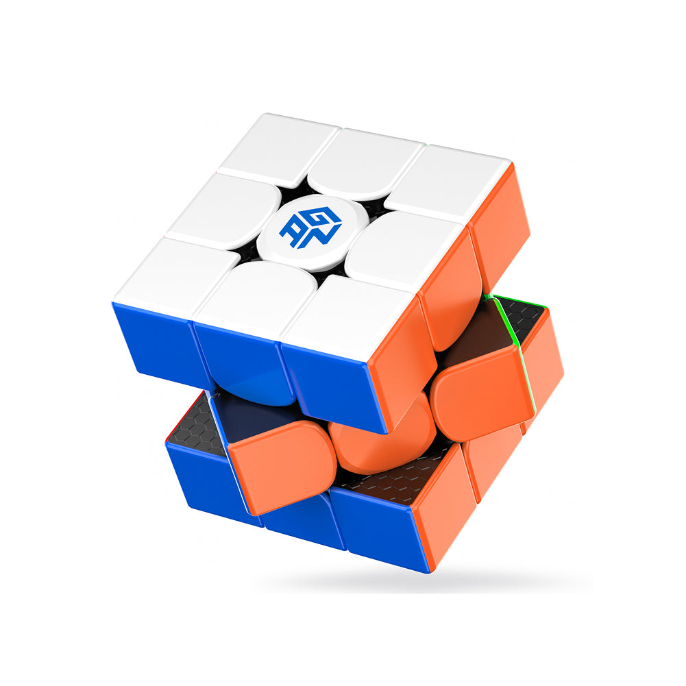 Partially scrambled 3x3 speed cube puzzle with white, blue, orange, and green pieces and logo centerpiece