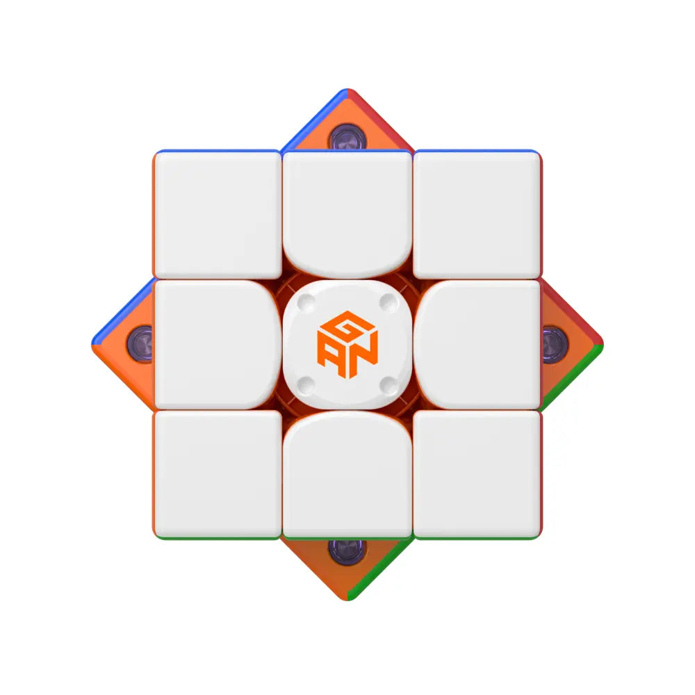GANCUBE advanced speed cube with white tiles and GAN logo, top view, speedcubing puzzle.