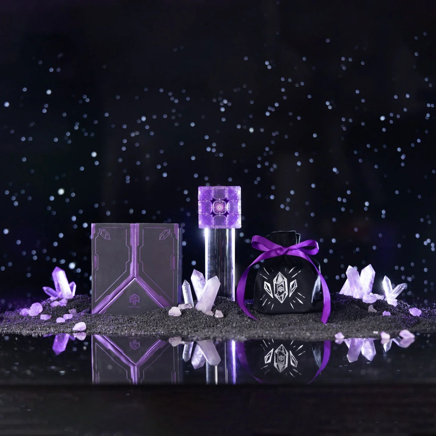 Purple Gan16 Maglev cube puzzle with crystals, black box, and velvet pouch on black surface
