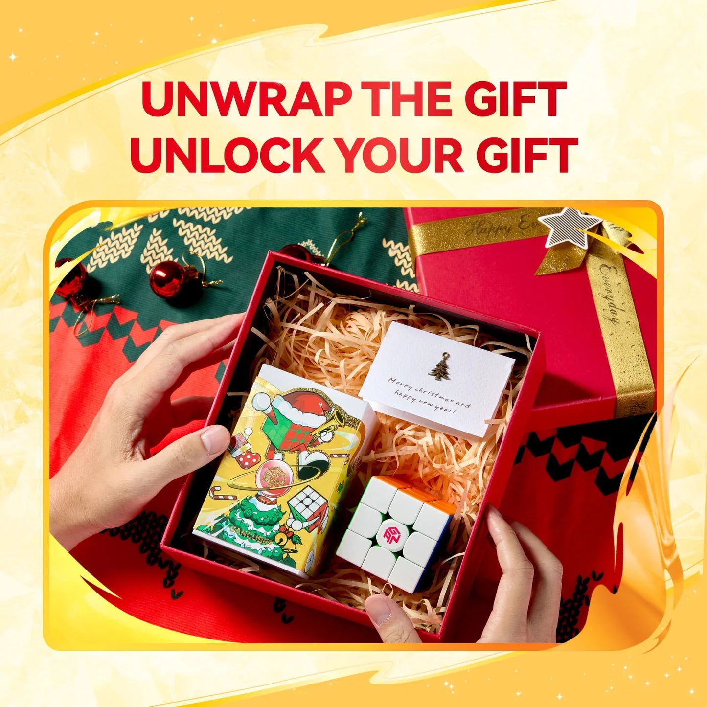 Hands holding a red gift box with a Gan356 Me cube, festive packaging, and a Christmas card on holiday decor