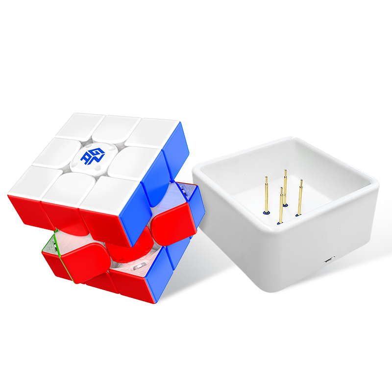 Partially disassembled GAN 1x1 Rubik's Cube with white charging dock on white background