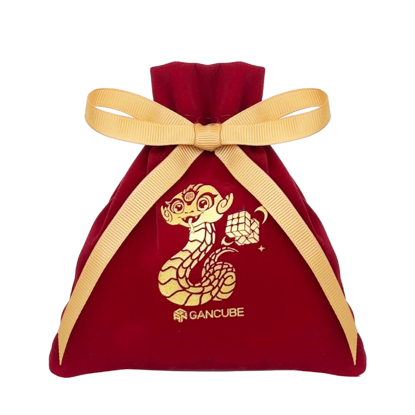 Red velvet drawstring bag with gold ribbon and golden snake and Rubik's cube design, GanCube logo