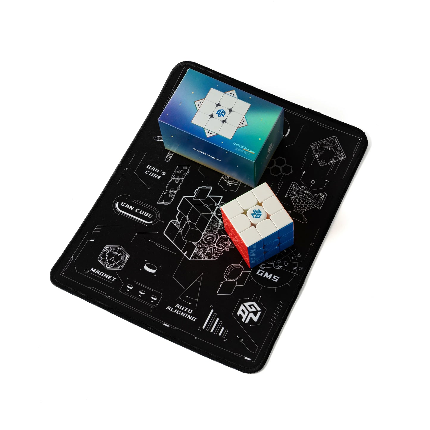 Gan12 Maglev 3x3 speed cube and box on black Gan Cube mat with white technical illustrations