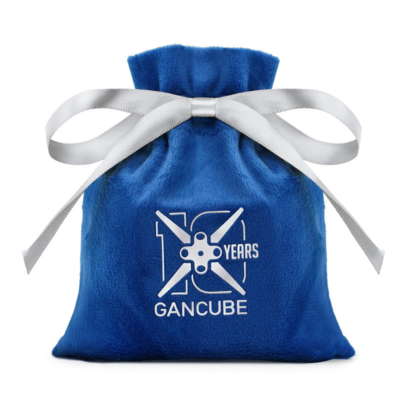 Blue velvet drawstring pouch with silver ribbon and GanCube 10 years anniversary logo
