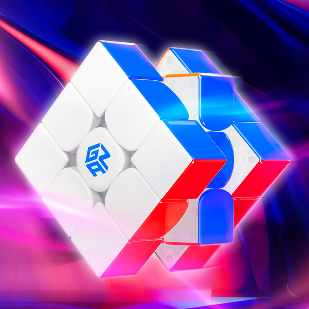 GAN branded white speed cube with blue and red stickers, partially opened showing internal honeycomb structure