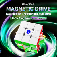A GANCUBE GAN17 MagDrive magnetic drive puzzle cube shown at an angle against a dark background with glowing green and purple swirls. The cube is mostly white with green and red edges, and the center piece has a blue logo.