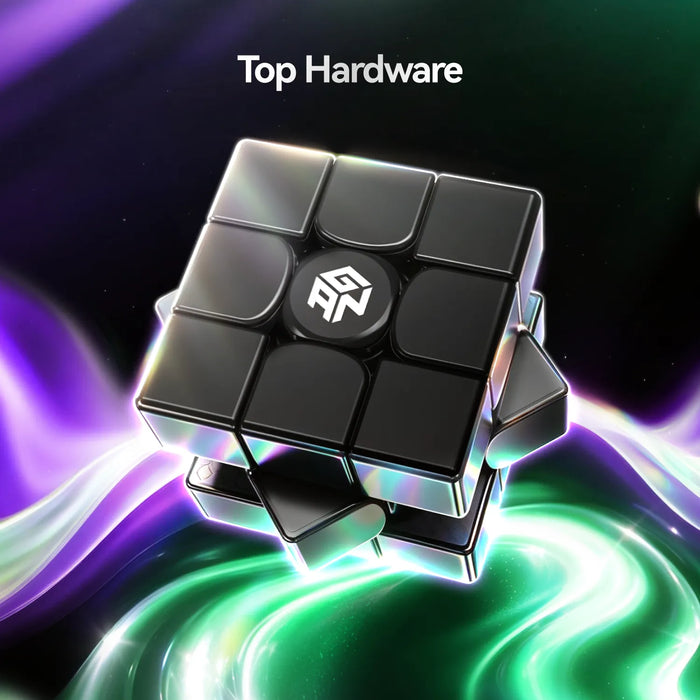 A black 3x3 puzzle cube with a white logo on the center piece, floating above a glowing green and purple abstract background. The text 'Top Hardware' is visible at the top.
