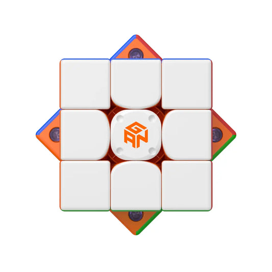 GANCUBE advanced speed cube with white tiles and GAN logo, top view, speedcubing puzzle.