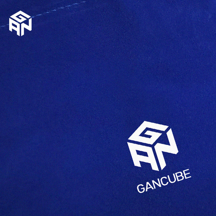 Blue velvet bag featuring white GAN CUBE logo and branding on soft fabric